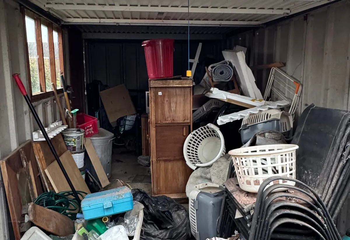 Furniture and belongings part-way through a house clearance